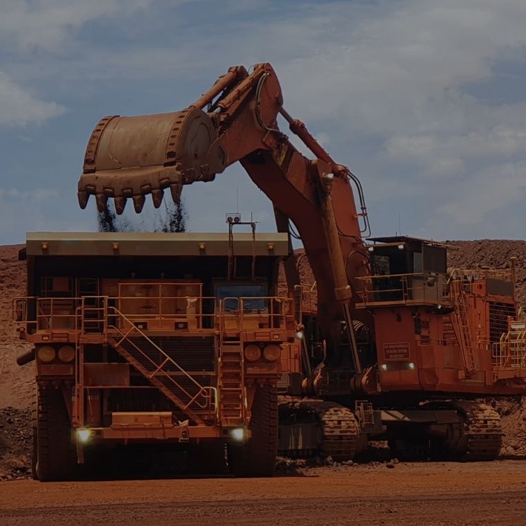 Excavator filling haul truck